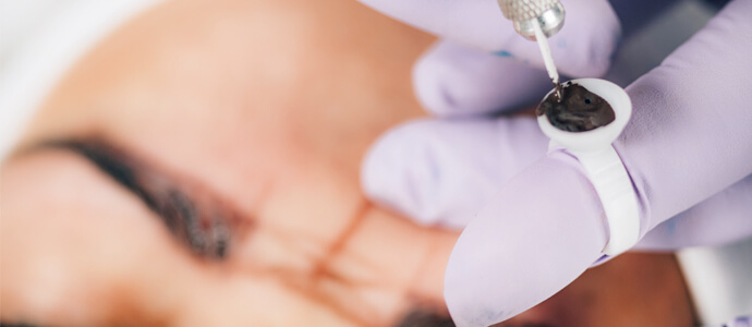 Woman getting eyebrow treatment